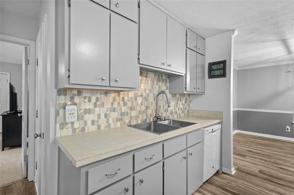 2888 Cardinal Trace Duluth, GA 30096 - Photo 17 of 51 a kitchen with white cabinets and sink