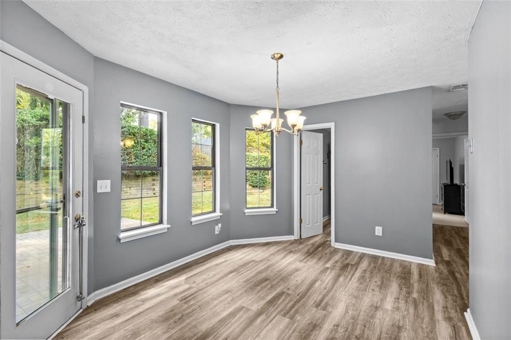 2888 Cardinal Trace Duluth, GA 30096 - Photo 19 of 51 a view of livingroom with window hardwood floor kitchen view and a window