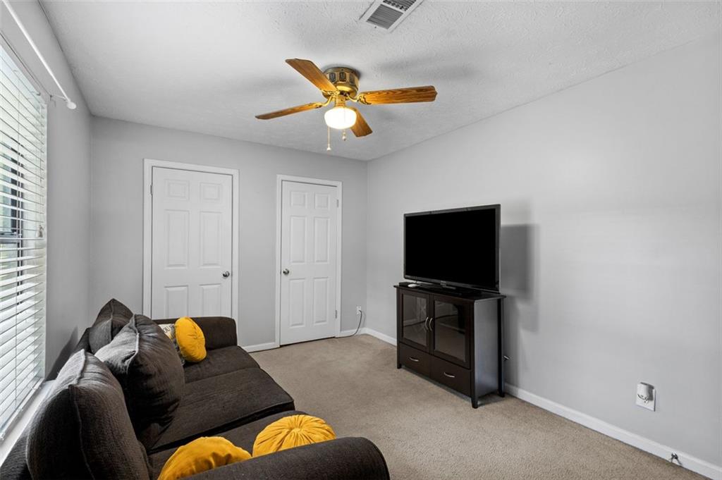 2888 Cardinal Trace Duluth, GA 30096 - Photo 21 of 51 a living room with furniture and a flat screen tv