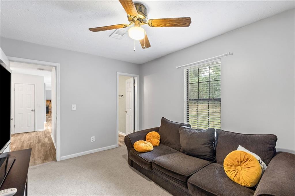 2888 Cardinal Trace Duluth, GA 30096 - Photo 22 of 51 a living room with furniture and a window