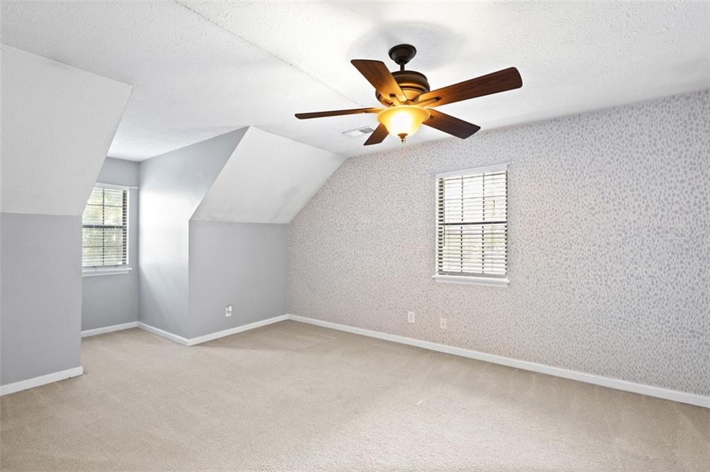 2888 Cardinal Trace Duluth, GA 30096 - Photo 32 of 51 an empty room with windows and fan