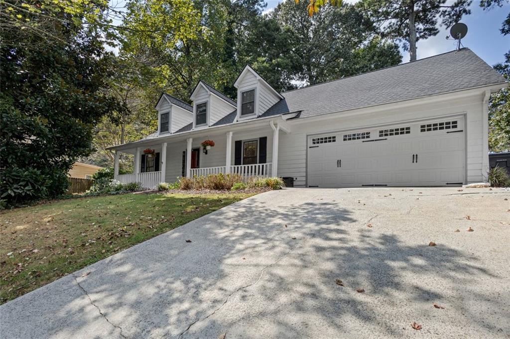 2888 Cardinal Trace Duluth, GA 30096 - Photo 5 of 51 a front view of a house with a garden