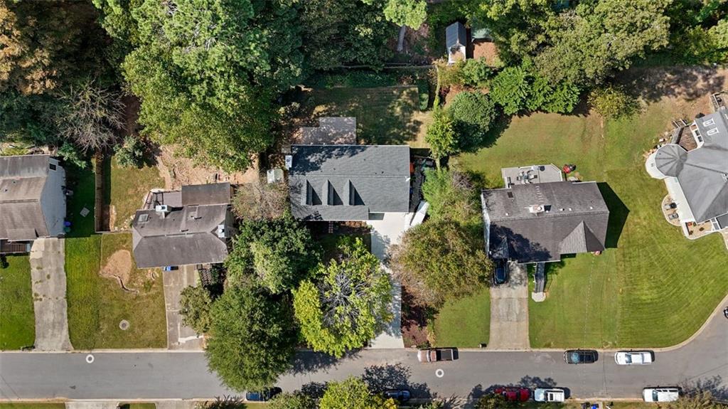 2888 Cardinal Trace Duluth, GA 30096 - Photo 6 of 51 an aerial view of a house with outdoor space and a lake view