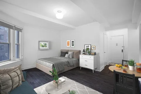 a bedroom with a bed and a couch