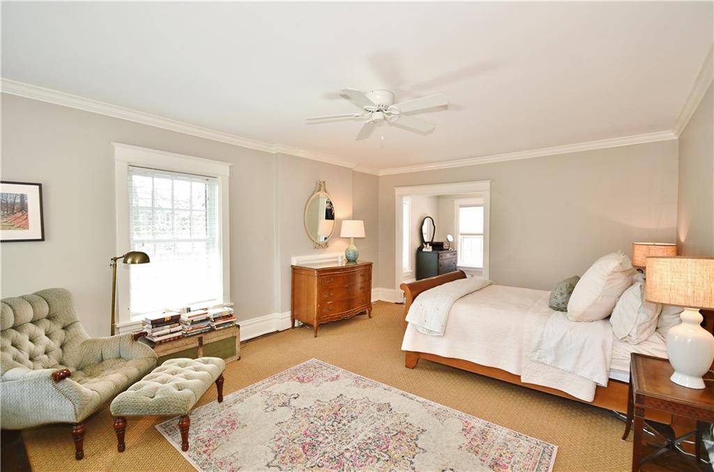 6623 Kinsman Road Pittsburgh, PA 15217 - Photo 18 of 25 a bedroom with a bed and wooden floor