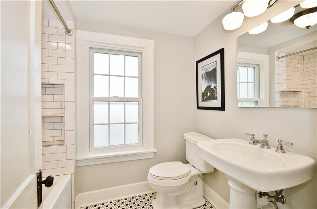 6623 Kinsman Road Pittsburgh, PA 15217 - Photo 21 of 25 a bathroom with a sink a toilet and a mirror
