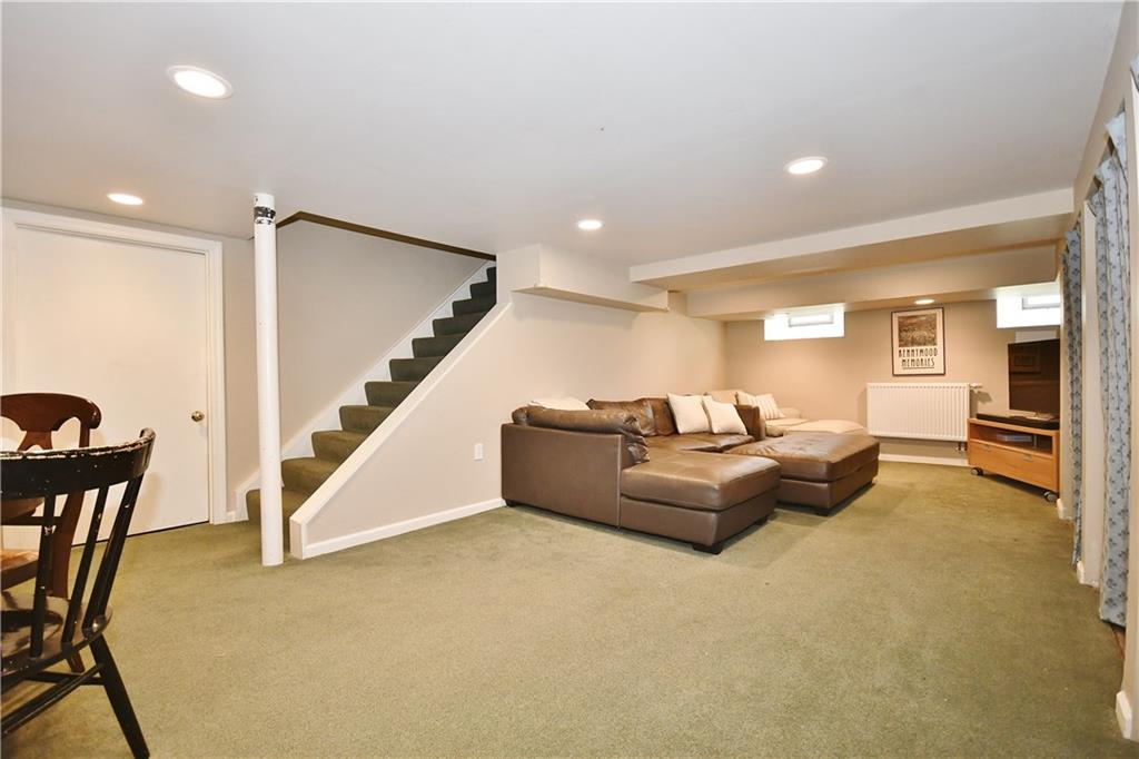 6623 Kinsman Road Pittsburgh, PA 15217 - Photo 24 of 25 a living room with furniture and a wooden floor