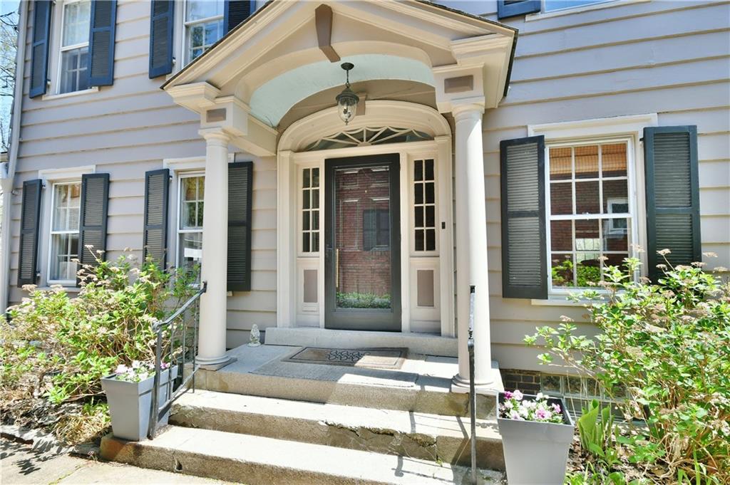 6623 Kinsman Road Pittsburgh, PA 15217 - Photo 3 of 25 a front view of a house with a porch