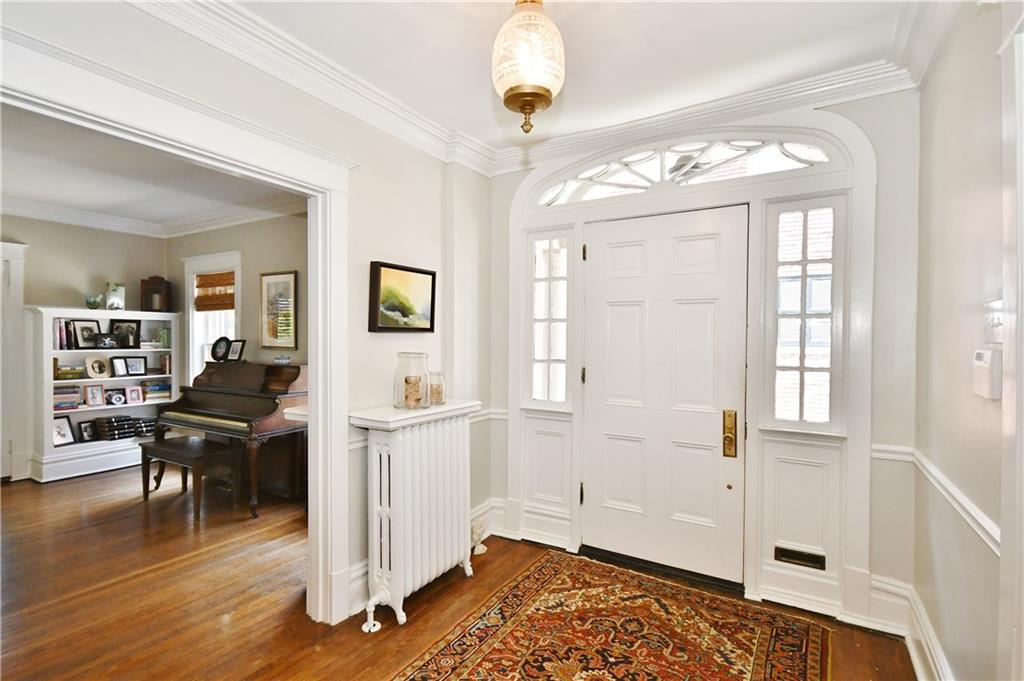 6623 Kinsman Road Pittsburgh, PA 15217 - Photo 4 of 25 a view of a livingroom with furniture wooden floor and a window