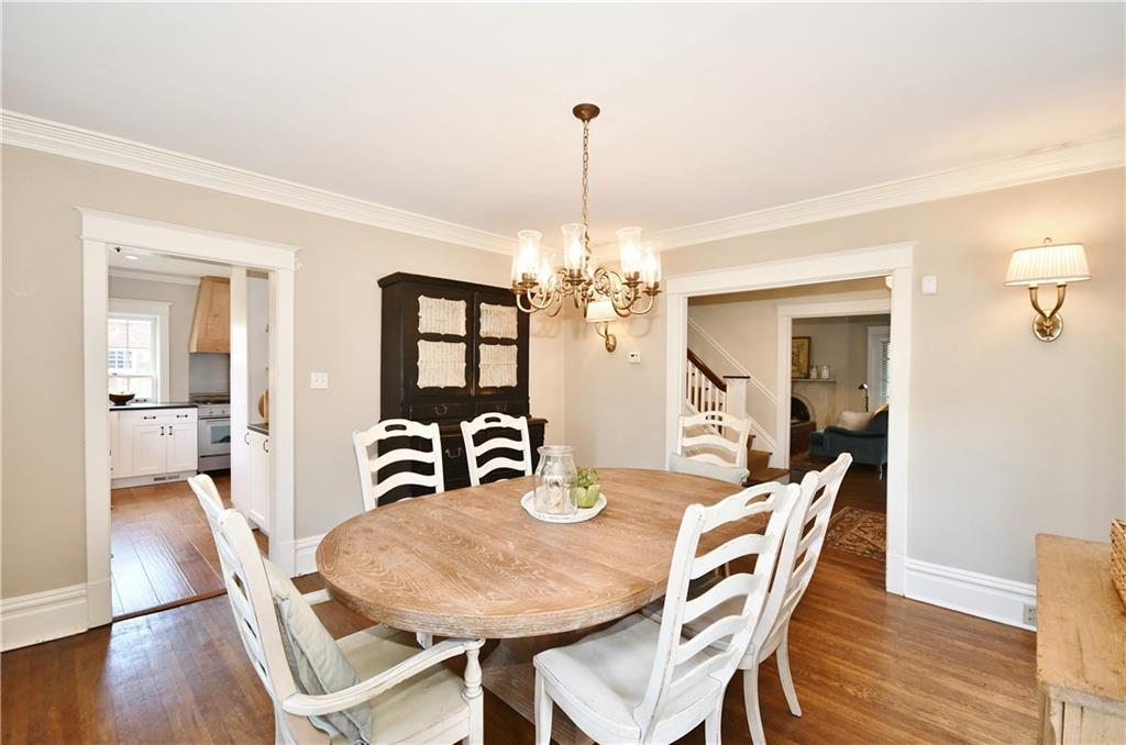 6623 Kinsman Road Pittsburgh, PA 15217 - Photo 9 of 25 a view of a dining room with furniture a chandelier and wooden floor