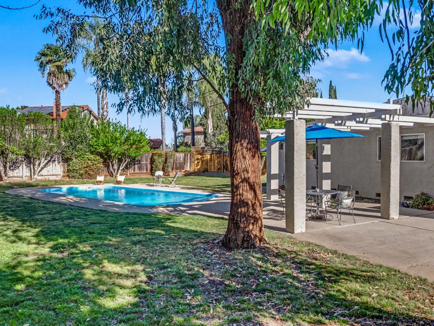 6455 Kensington Place Gilroy, CA 95020 - Photo 27 of 32 a view of a house with backyard and a tree