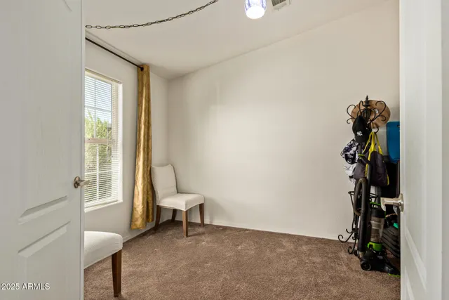 a view of room with window and hallway