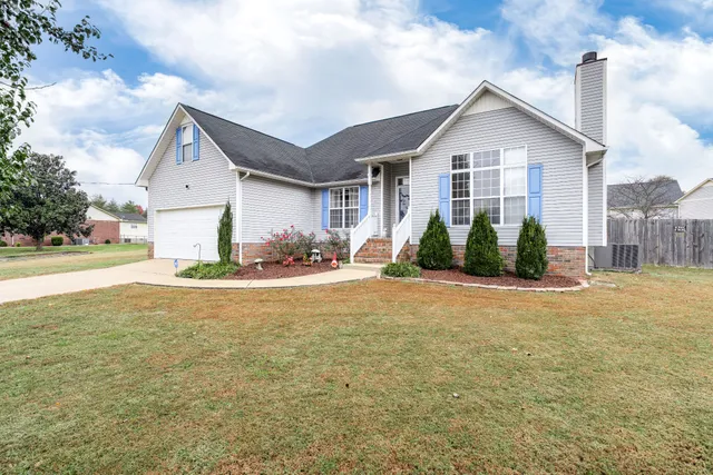 a view of a house with swimming pool and porch