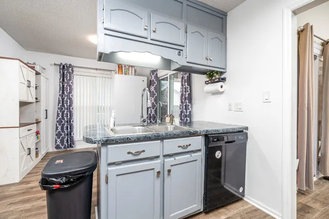 a bedroom with a bed and dresser