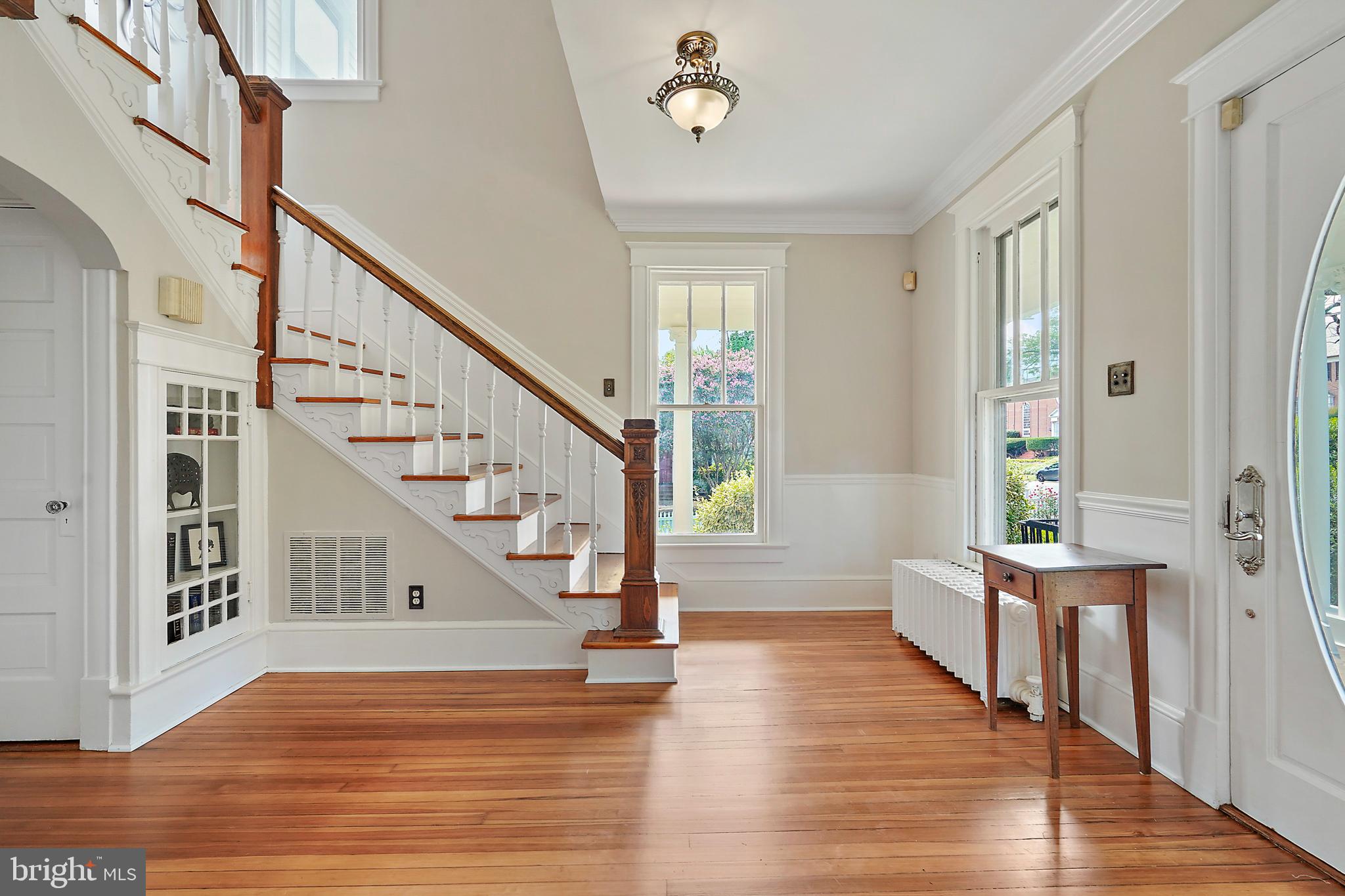 1503 Russell Road Alexandria, VA 22301 - Photo 2 of 31 a view of entryway with wooden floor and stairs