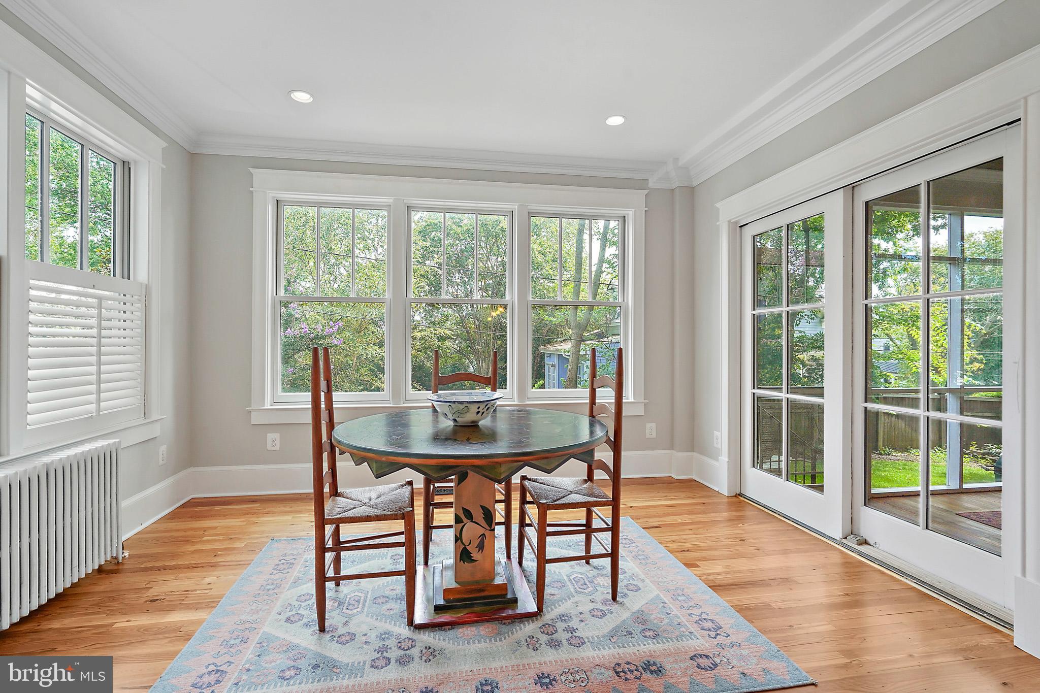 1503 Russell Road Alexandria, VA 22301 - Photo 8 of 31 a view of a dining room with furniture window and wooden floor