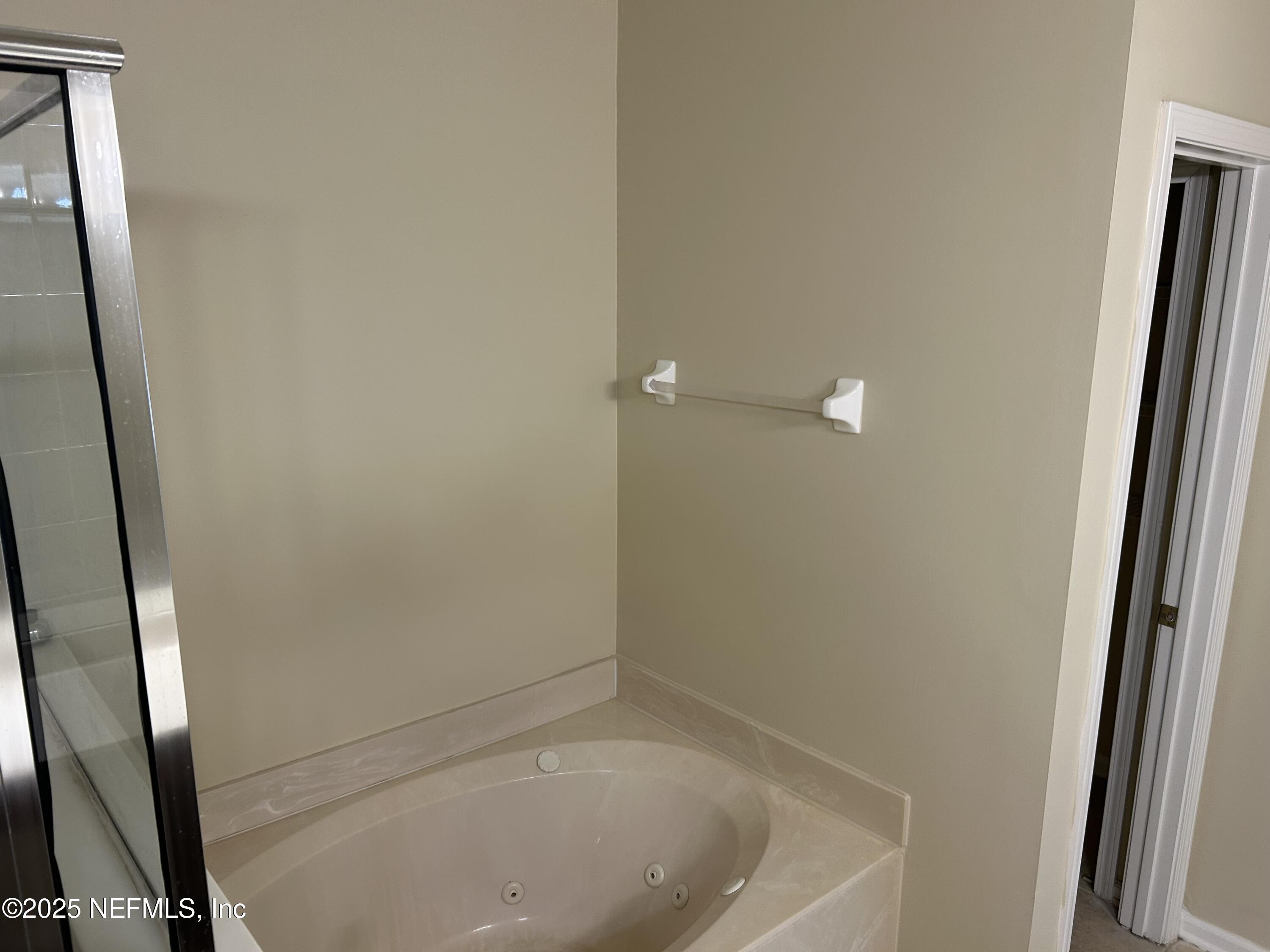 1425 Laurel Oak Drive Fleming Island, FL 32003 - Photo 14 of 25 an empty room with a mirror