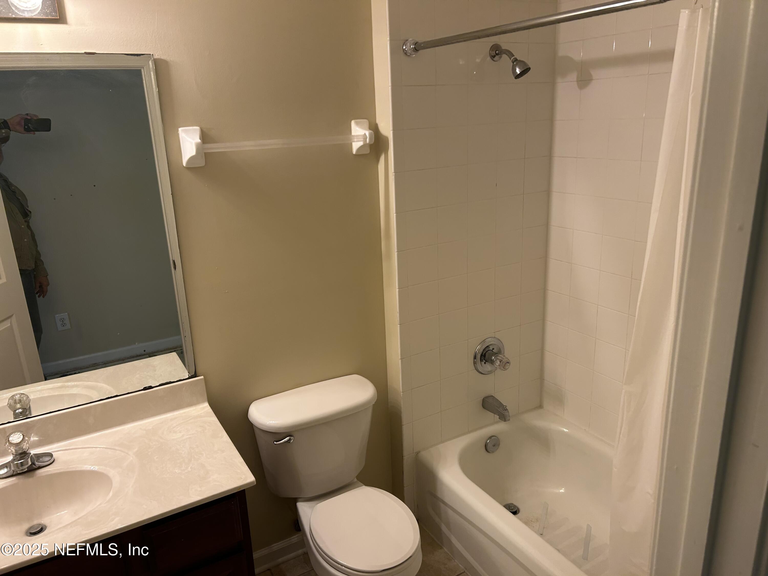 1425 Laurel Oak Drive Fleming Island, FL 32003 - Photo 17 of 25 a white toilet sitting next to a bath tub