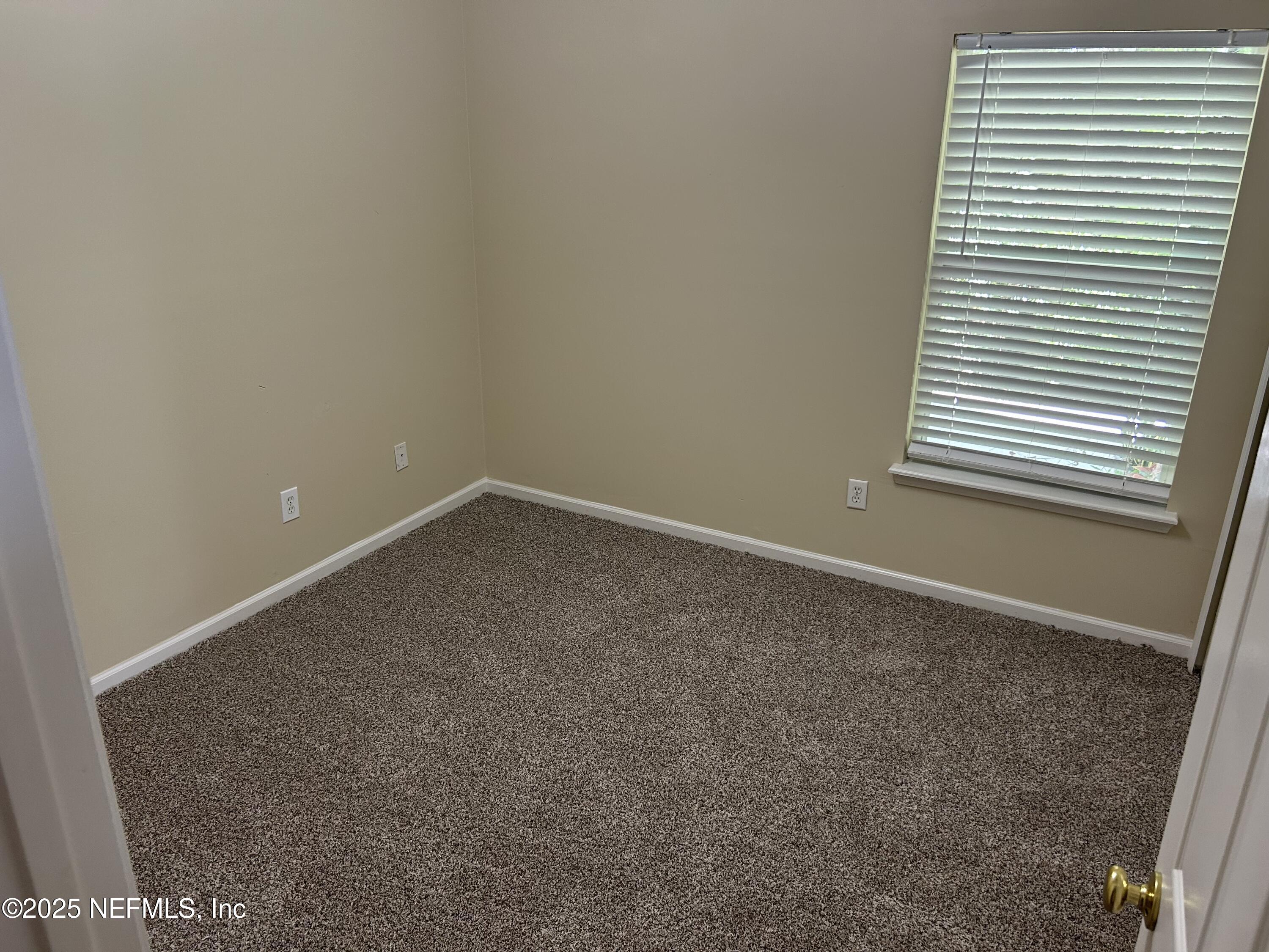 1425 Laurel Oak Drive Fleming Island, FL 32003 - Photo 19 of 25 an empty room with a window