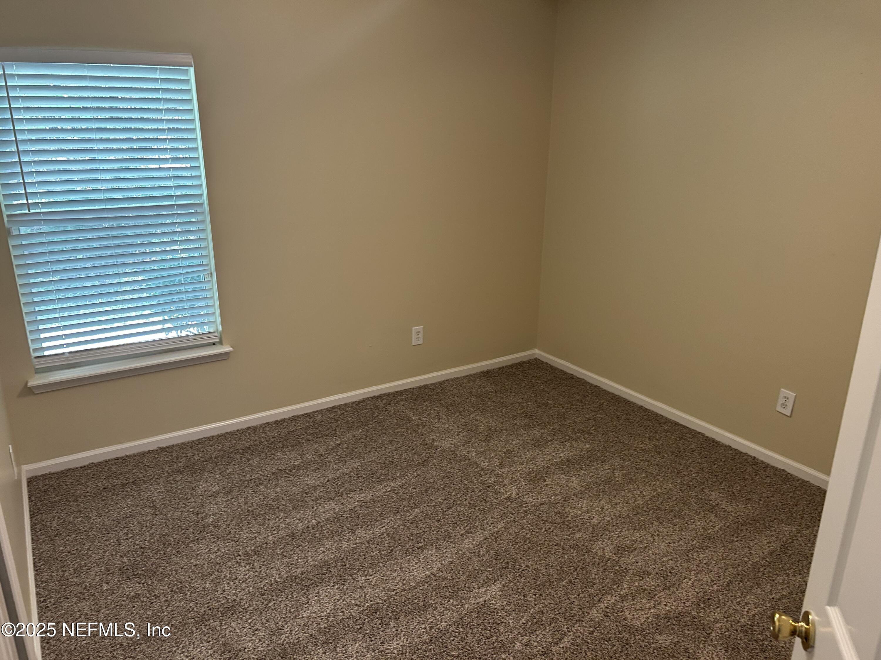 1425 Laurel Oak Drive Fleming Island, FL 32003 - Photo 20 of 25 an empty room with a workbench