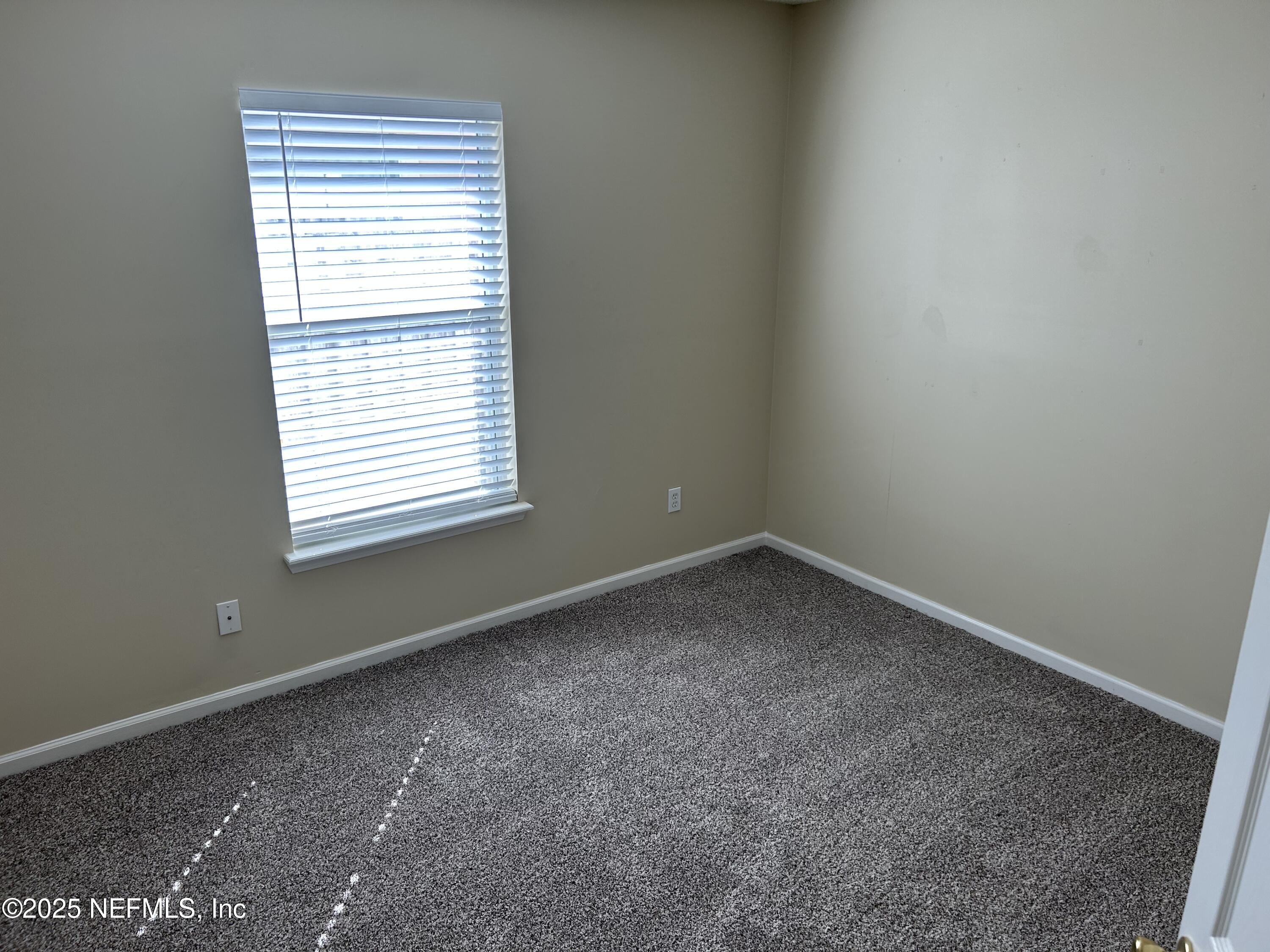 1425 Laurel Oak Drive Fleming Island, FL 32003 - Photo 21 of 25 an empty room with a window