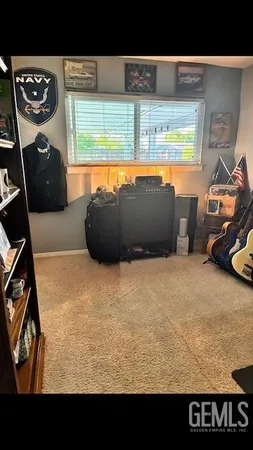 a view of a living room and kitchen