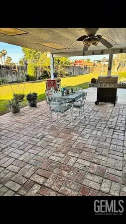 a view of a swimming pool with an outdoor seating