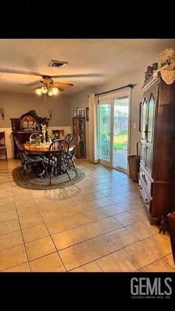 a view of a living room and chandelier