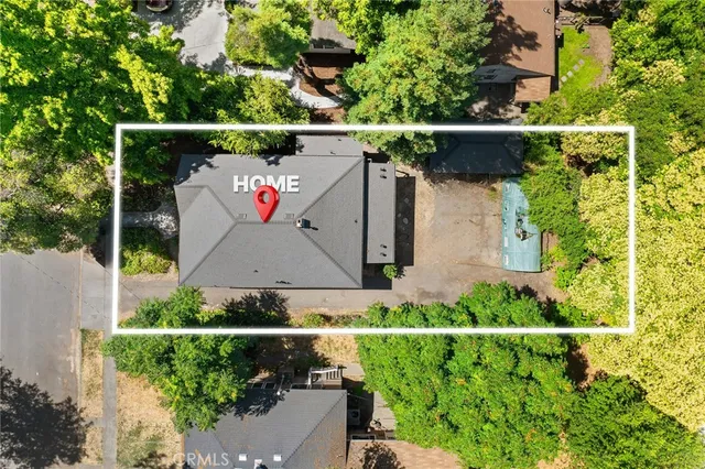 an aerial view of house with a yard