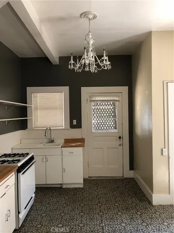 a kitchen with a sink and a refrigerator