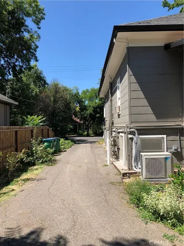 a view of a house with a yard and garage