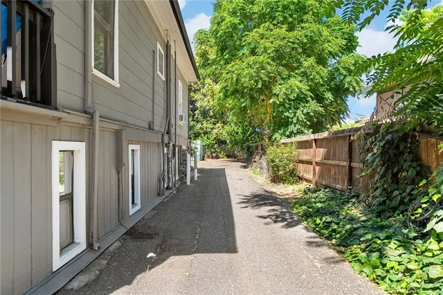 a view of a pathway with a house