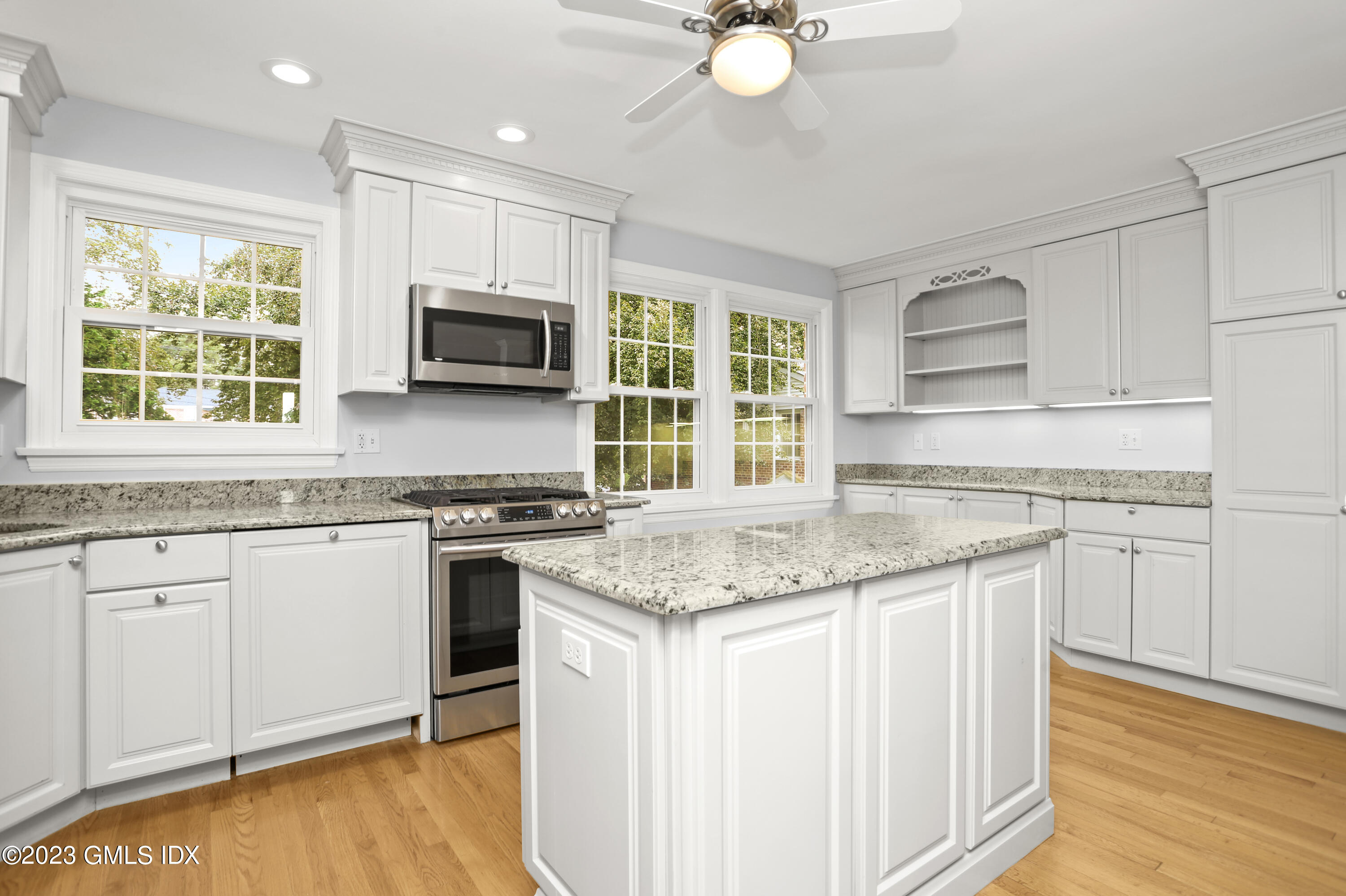 a kitchen with stainless steel appliances granite countertop a stove and a sink