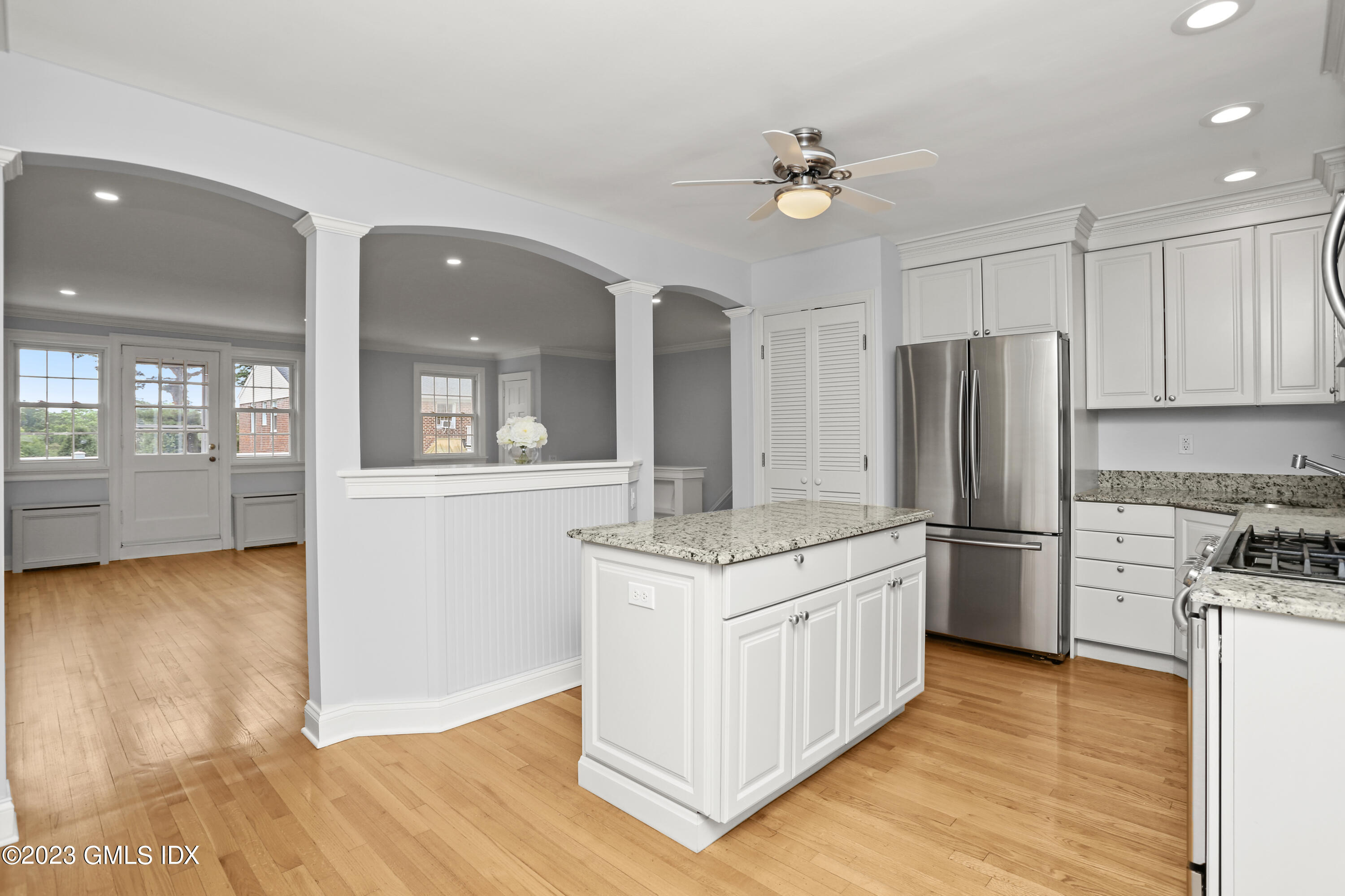 149 Putnam Park, Unit 149 Greenwich, CT 06830 - Photo 2 of 43 a kitchen with a refrigerator and countertop