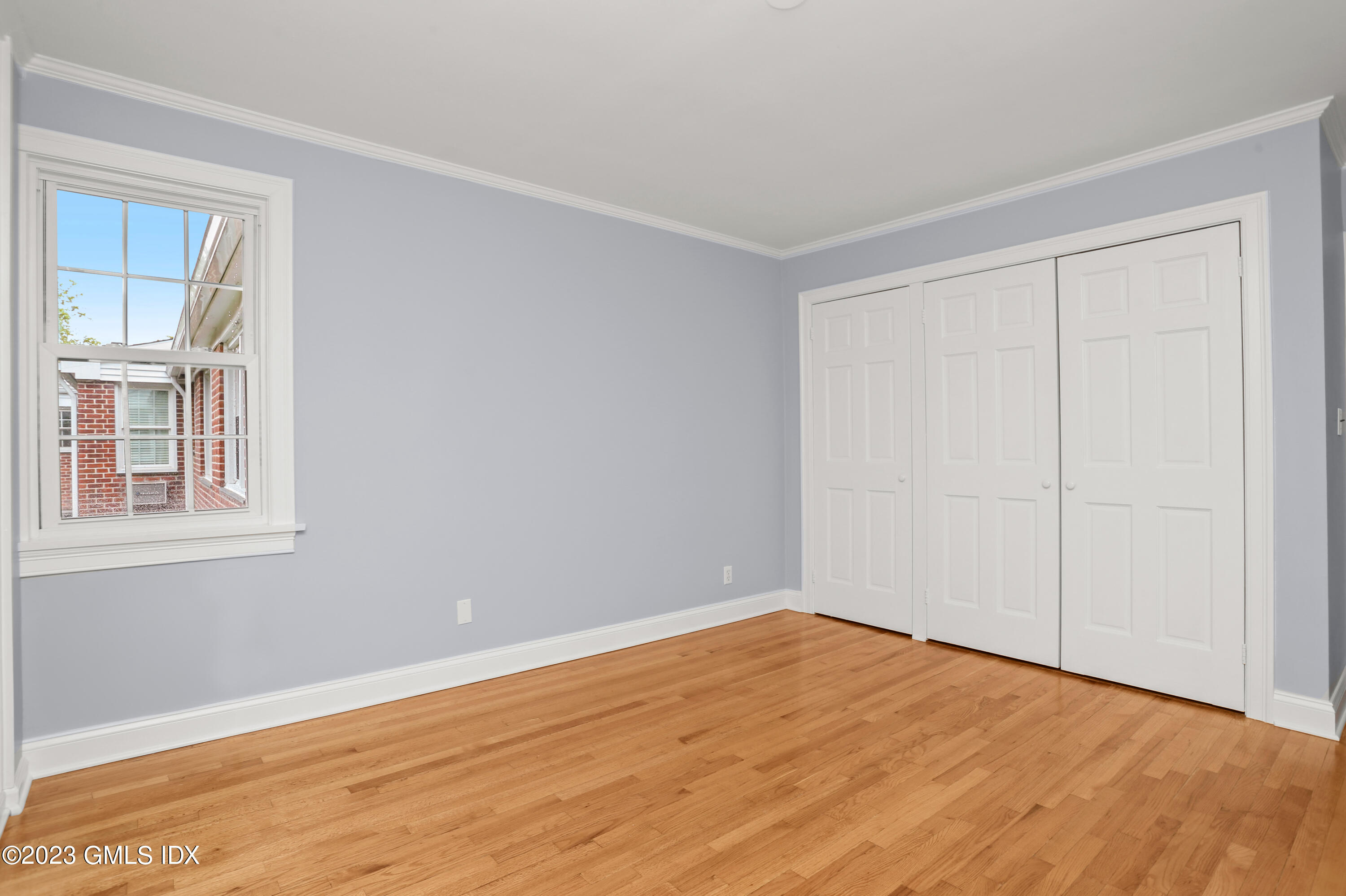 149 Putnam Park, Unit 149 Greenwich, CT 06830 - Photo 23 of 43 a view of empty room with wooden floor