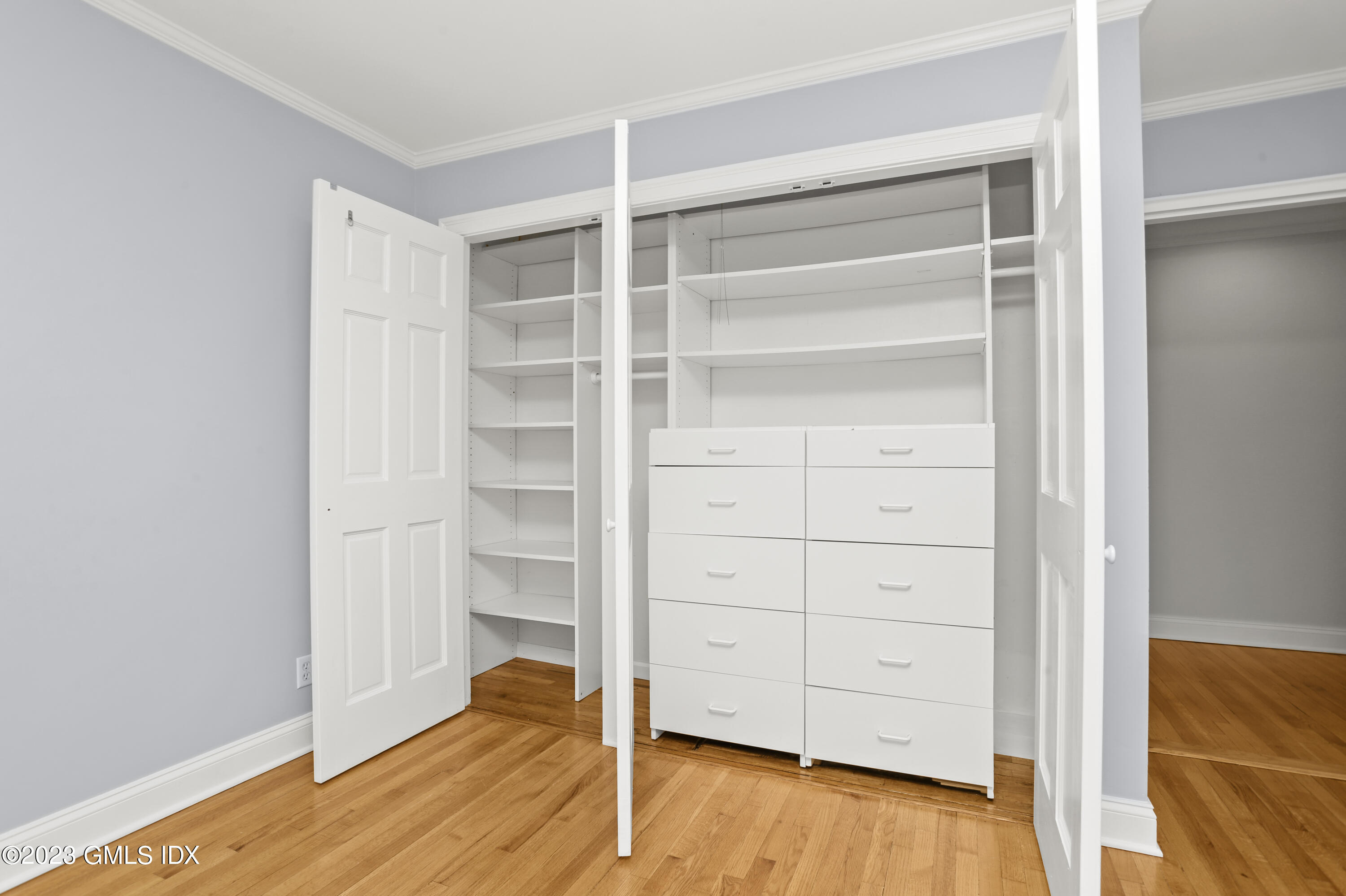 149 Putnam Park, Unit 149 Greenwich, CT 06830 - Photo 24 of 43 a view of walk in closet with empty racks