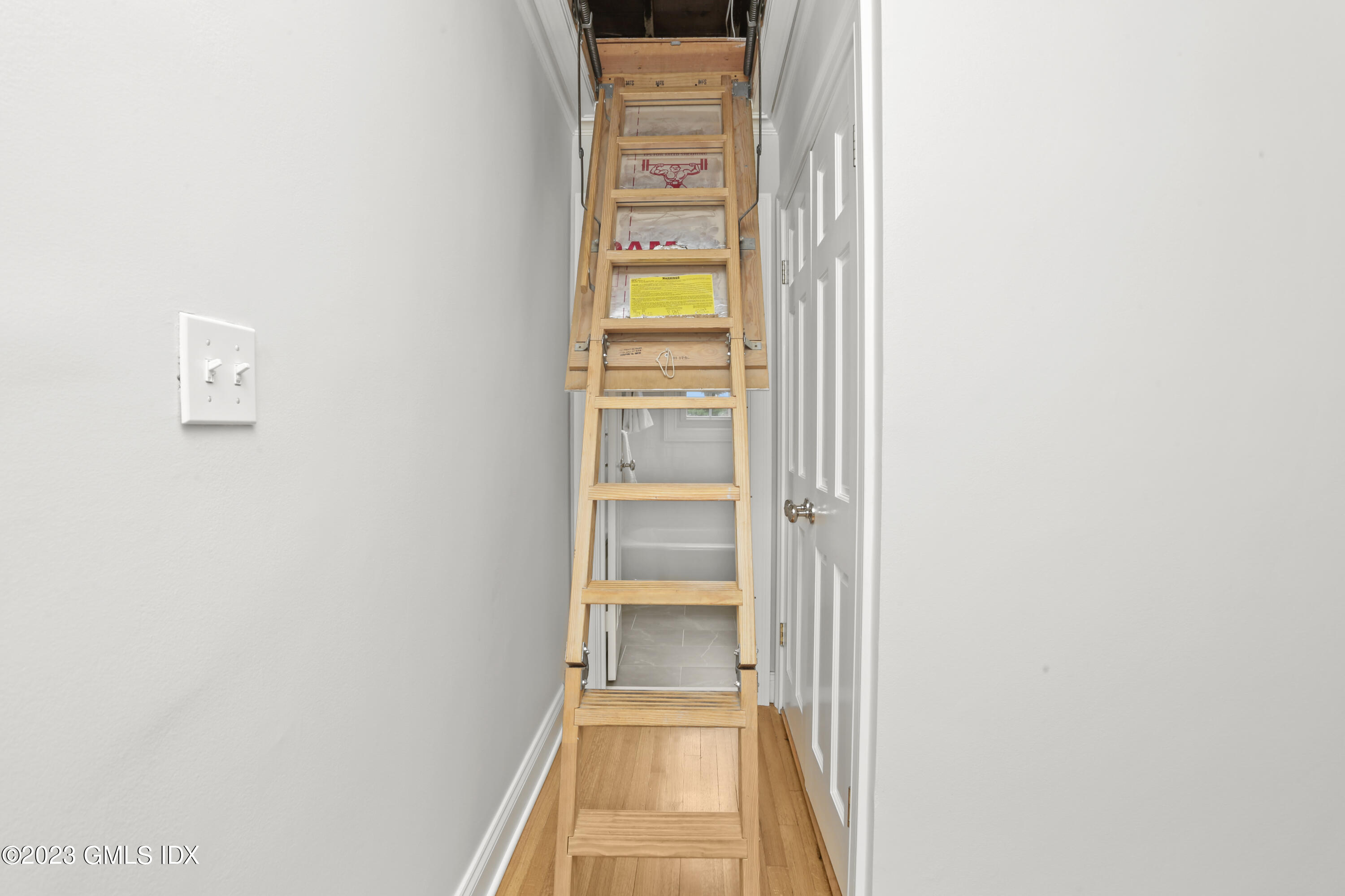 149 Putnam Park, Unit 149 Greenwich, CT 06830 - Photo 31 of 43 a view of a hallway with a window