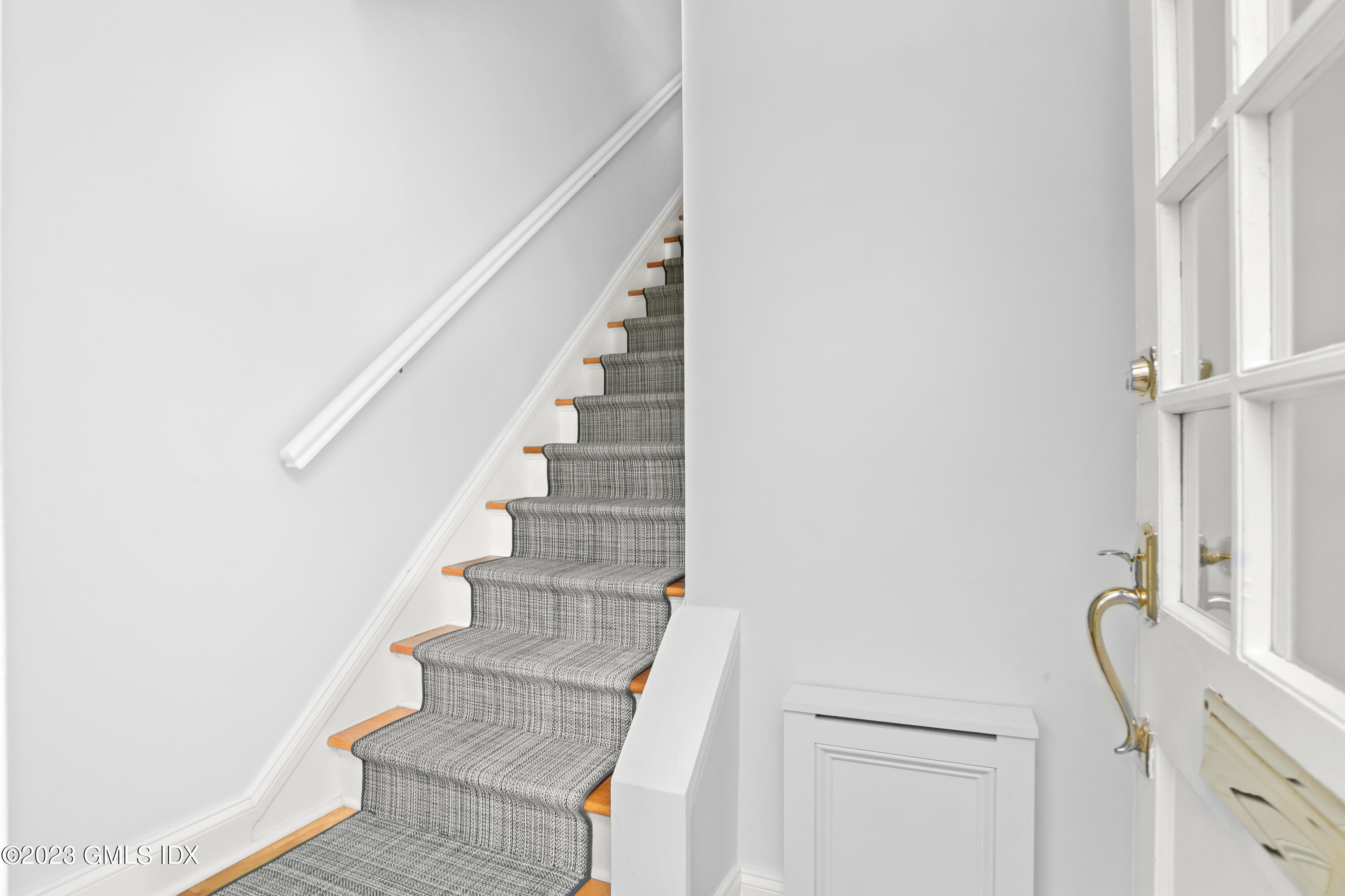 149 Putnam Park, Unit 149 Greenwich, CT 06830 - Photo 34 of 43 a view of staircase with white walls and windows