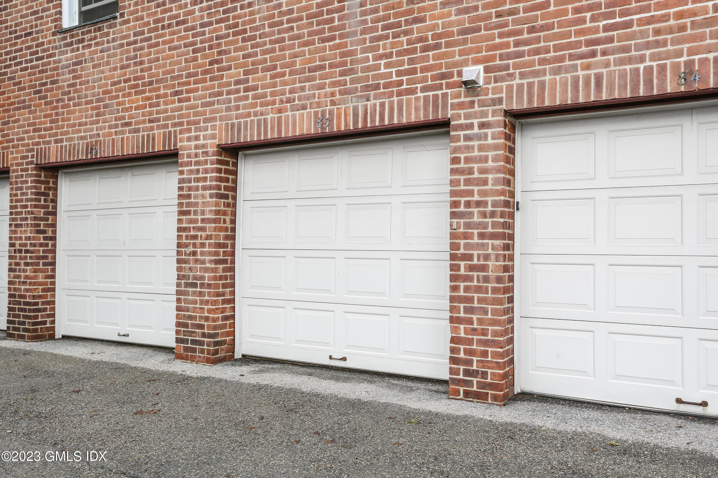 149 Putnam Park, Unit 149 Greenwich, CT 06830 - Photo 39 of 43 a view of a house with garage