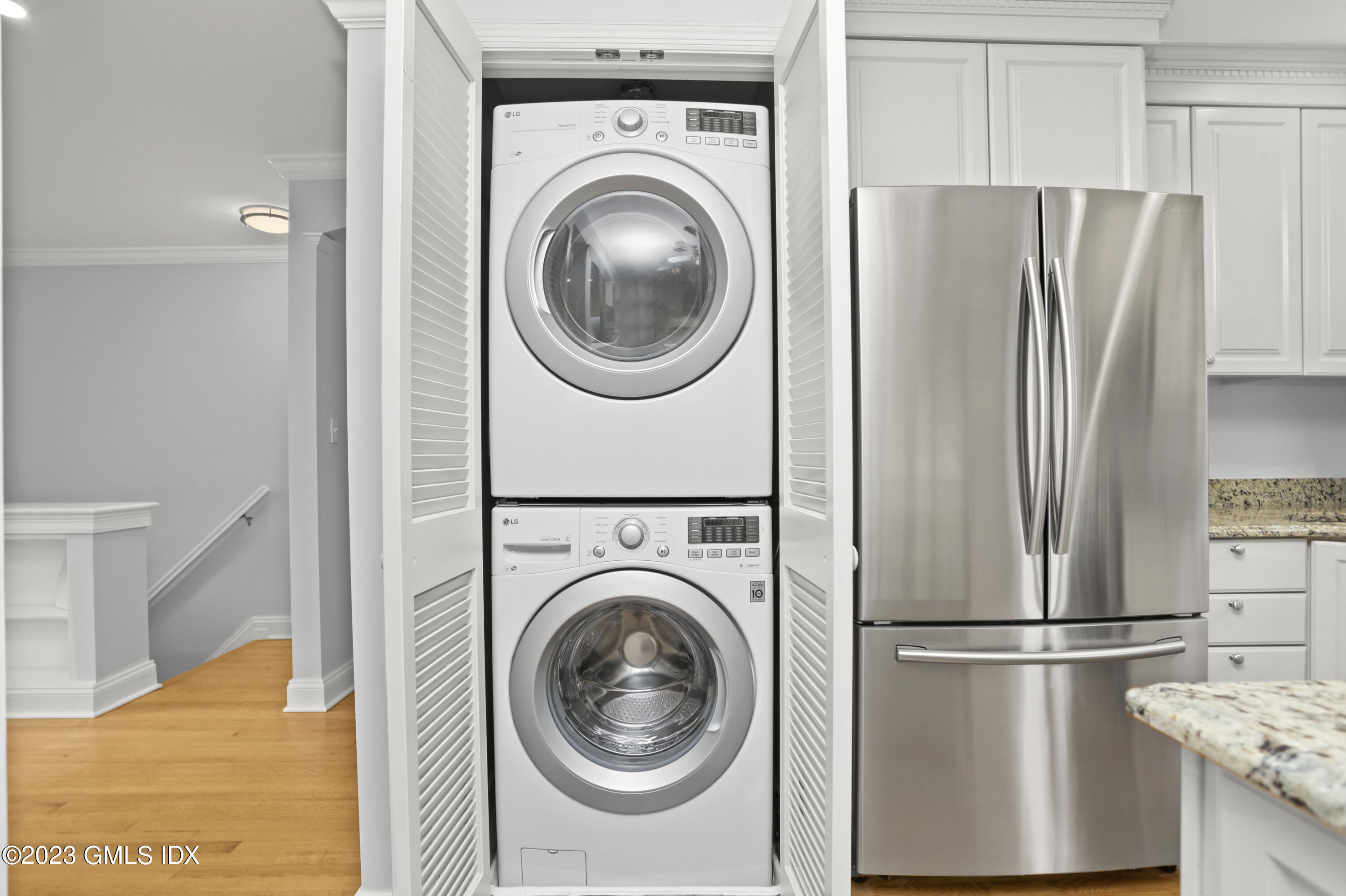 149 Putnam Park, Unit 149 Greenwich, CT 06830 - Photo 9 of 43 a utility room with dryer and washer