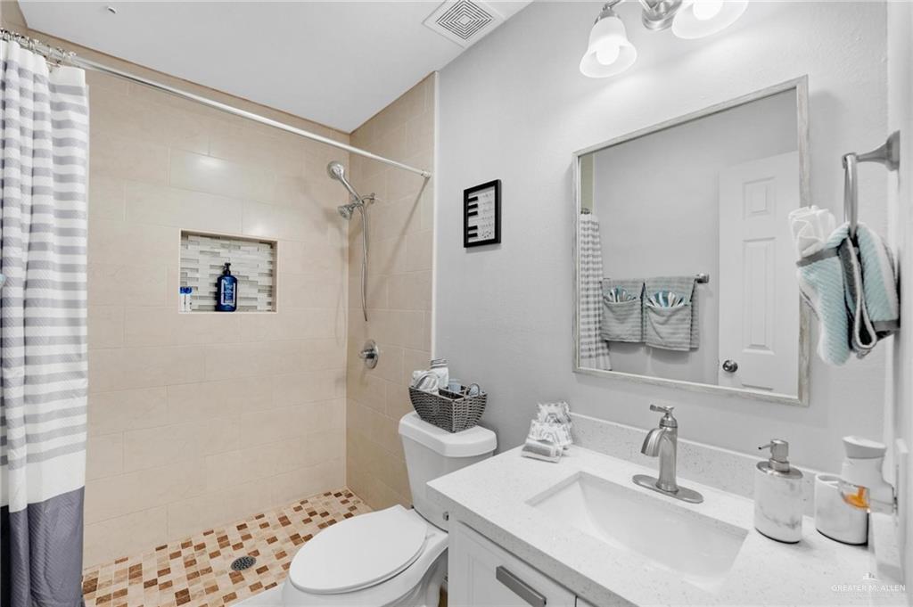 1103 West 26th Street Mission, TX 78574 - Photo 12 of 16 a bathroom with a sink toilet and shower