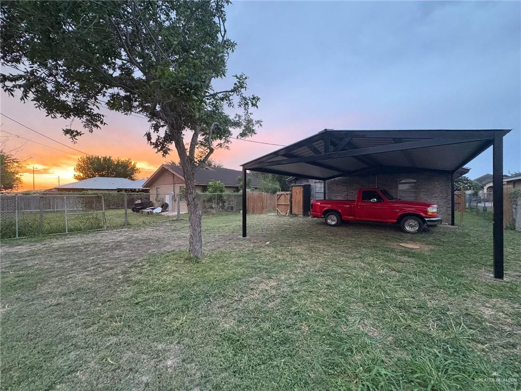 1103 West 26th Street Mission, TX 78574 - Photo 14 of 16 a small garden covered with tall trees