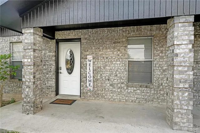 a front view of a house with white door