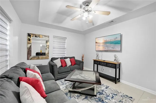 a living room with furniture and a window