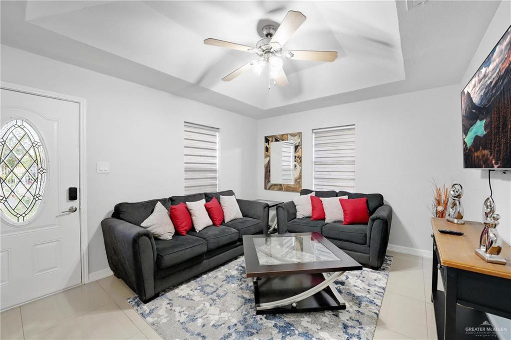 1103 West 26th Street Mission, TX 78574 - Photo 7 of 16 a living room with furniture and a flat screen tv