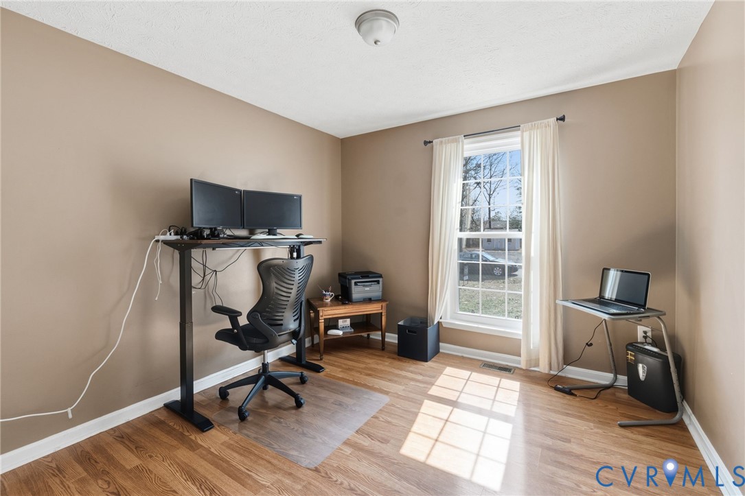 504 Gloucester Drive Ruther Glen, VA 22546 - Photo 12 of 28 a view of a workspace with furniture and a window