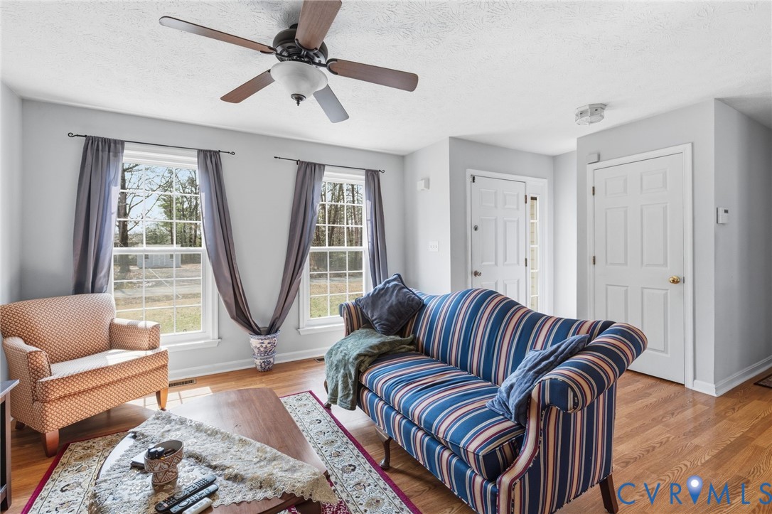 504 Gloucester Drive Ruther Glen, VA 22546 - Photo 3 of 28 a living room with a couch and a window