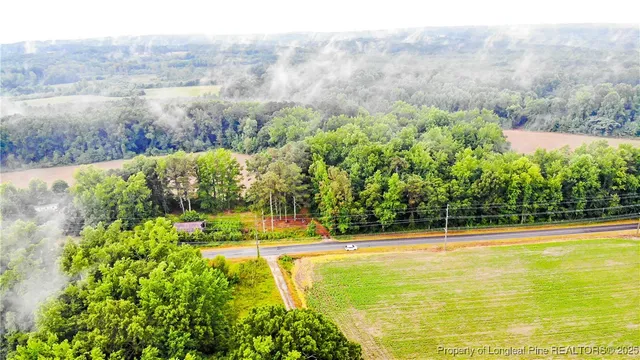 a view of a swimming pool and mountains in the background