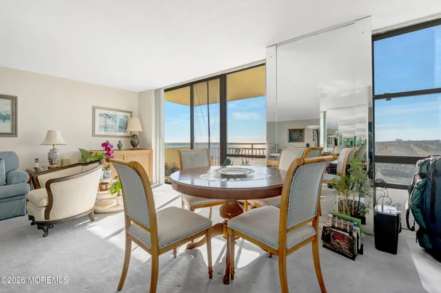 a bedroom with a bed and glass window