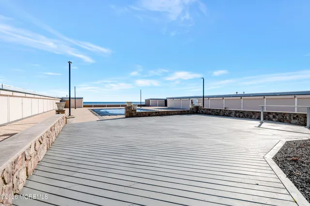 a bedroom with a bed and a night stand